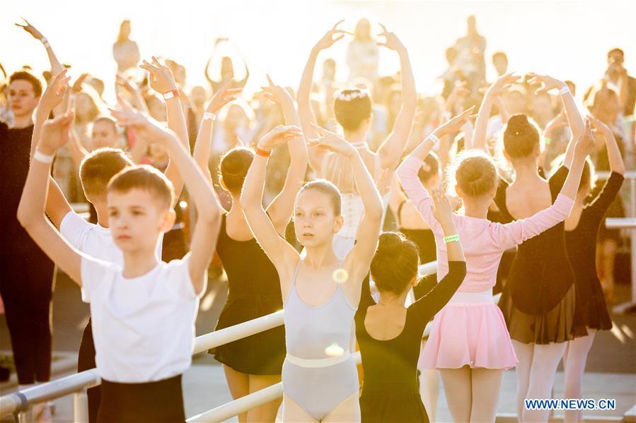 Ballet dancers take part in a ballet master class by Nikolay Tsiskaridze during The World Ballet Holidays Festival, in Moscow, Russia, on June 1, 2019. The World Ballet Holidays Festival is held from May 31 to June 2 at VDNH exhibition complex in Moscow. One of the highlights of the festival is an outdoor ballet class conducted by ballet dancer Nikolay Tsiskaridze. (Xinhua/Maxim Chernavsky)