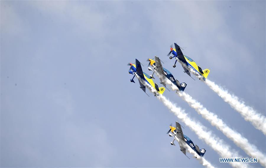 Enthusiasts in air sports give an aerobatic show during the opening of the 11th Air Sports Culture and Tourism Festival in Anyang, central China\'s Henan Province, June 3, 2019. The event kicked off Monday in the city of Anyang, attracting air sports fans from home and abroad. (Xinhua/Li Jianan)