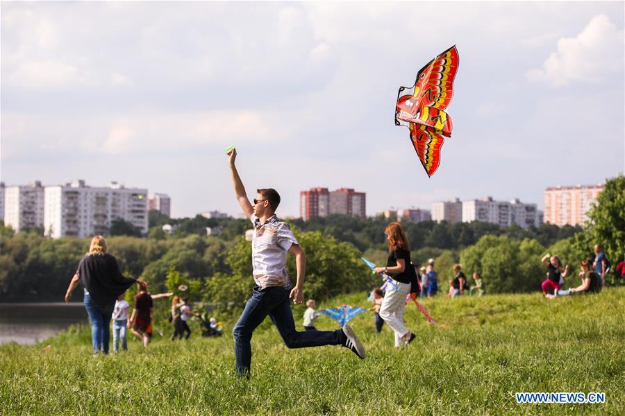 A man flies a kite during the Motley Sky festival in Moscow, Russia, on May 26, 2019. The Motley Sky festival was held in Moscow from May 25 to 26. (Xinhua/Maxim Chernavsky)
