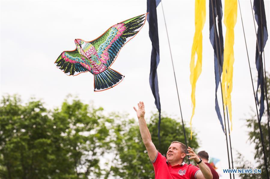 A man flies a kite during the Motley Sky festival in Moscow, Russia, on May 26, 2019. The Motley Sky festival was held in Moscow from May 25 to 26. (Xinhua/Maxim Chernavsky)