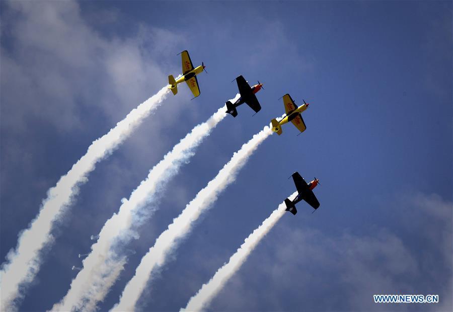 Enthusiasts in air sports give an aerobatic show during the opening of the 11th Air Sports Culture and Tourism Festival in Anyang, central China\'s Henan Province, June 3, 2019. The event kicked off Monday in the city of Anyang, attracting air sports fans from home and abroad. (Xinhua/Li An)