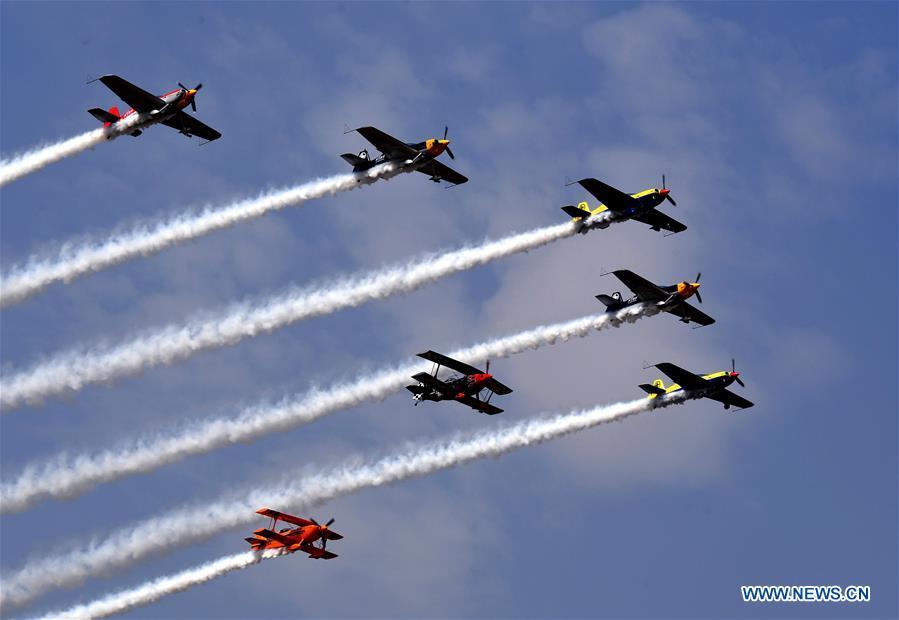 Enthusiasts in air sports give an aerobatic show during the opening of the 11th Air Sports Culture and Tourism Festival in Anyang, central China\'s Henan Province, June 3, 2019. The event kicked off Monday in the city of Anyang, attracting air sports fans from home and abroad. (Xinhua/Li An)