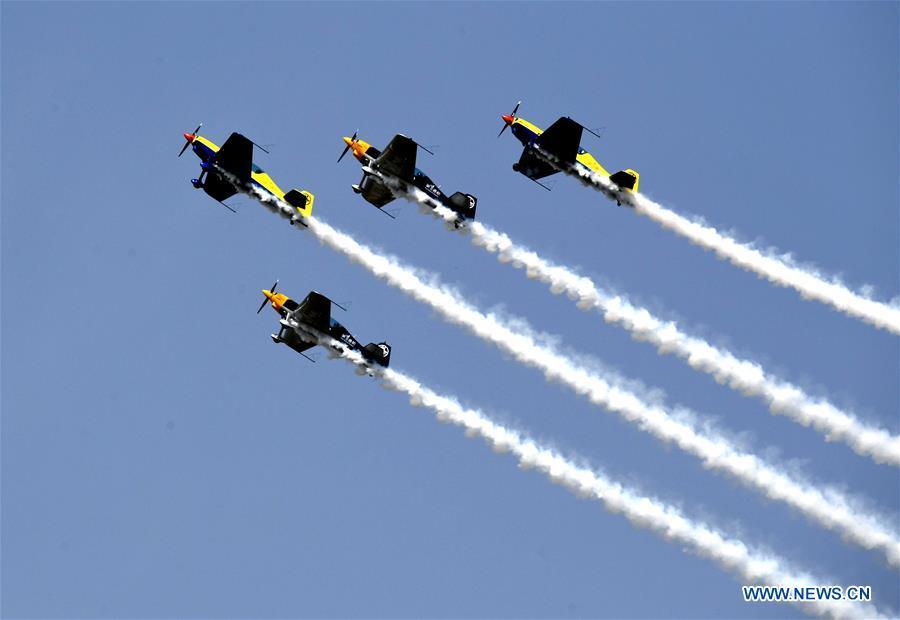 Enthusiasts in air sports give an aerobatic show during the opening of the 11th Air Sports Culture and Tourism Festival in Anyang, central China\'s Henan Province, June 3, 2019. The event kicked off Monday in the city of Anyang, attracting air sports fans from home and abroad. (Xinhua/Li An)