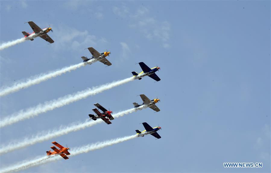Enthusiasts in air sports give an aerobatic show during the opening of the 11th Air Sports Culture and Tourism Festival in Anyang, central China\'s Henan Province, June 3, 2019. The event kicked off Monday in the city of Anyang, attracting air sports fans from home and abroad. (Xinhua/Li Jianan)