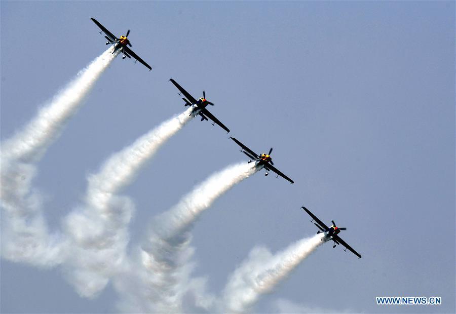 Enthusiasts in air sports give an aerobatic show during the opening of the 11th Air Sports Culture and Tourism Festival in Anyang, central China\'s Henan Province, June 3, 2019. The event kicked off Monday in the city of Anyang, attracting air sports fans from home and abroad. (Xinhua/Li An)