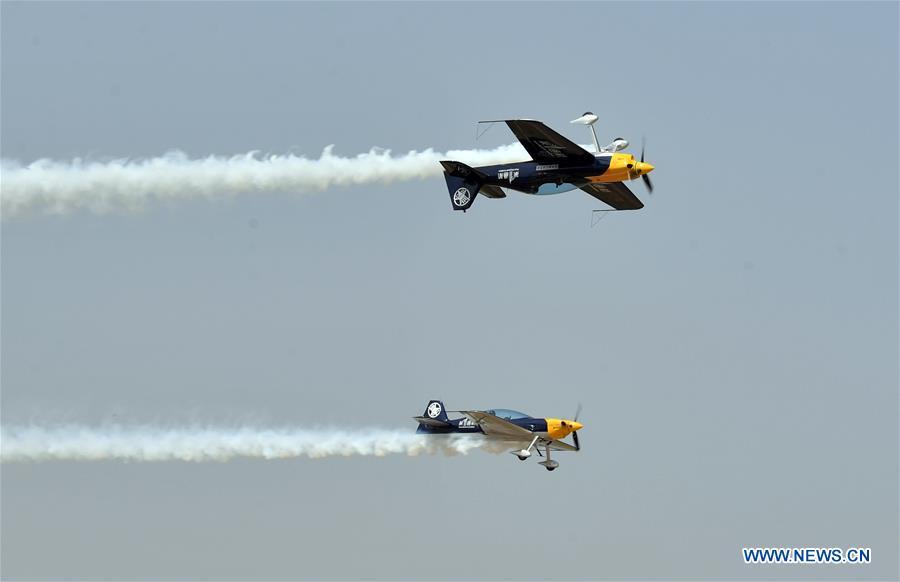 Enthusiasts in air sports give an aerobatic show during the opening of the 11th Air Sports Culture and Tourism Festival in Anyang, central China\'s Henan Province, June 3, 2019. The event kicked off Monday in the city of Anyang, attracting air sports fans from home and abroad. (Xinhua/Li Jianan)