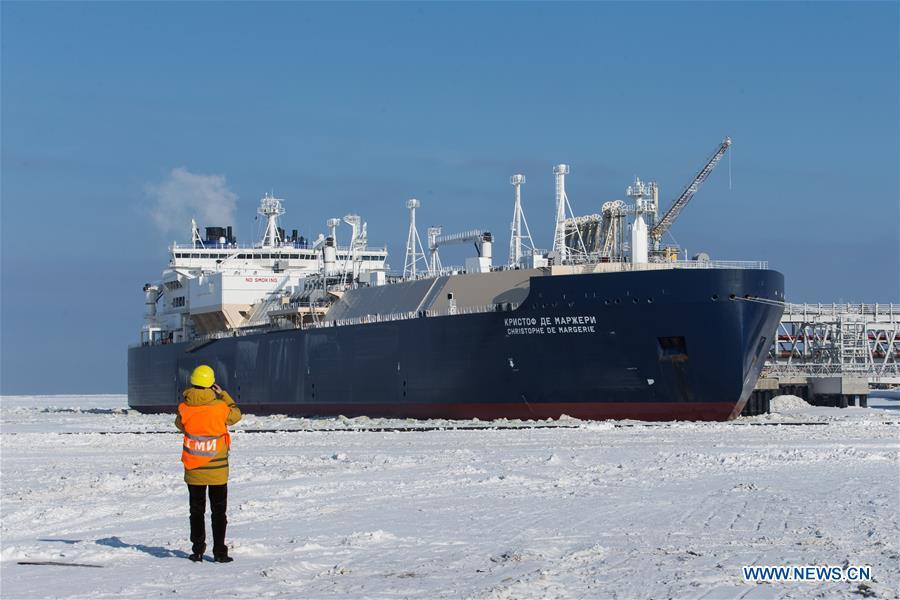 A journalist captures images of the Christophe de Margerie icebreaking LNG (liquefied natural gas) carrier, which serves the Yamal LNG project, at the Port of Sabetta in the Autonomous Okrug of Yamlo-Nenets, Russia, March 30, 2017. (Xinhua/Bai Xueqi)