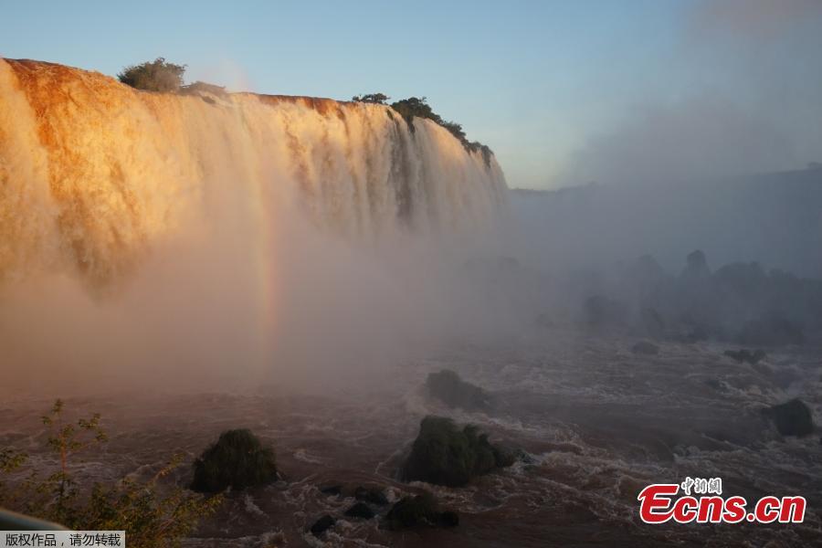 Picture of the Iguacu falls -considered as one of the largest waterfalls in the world- as seen from the Brazilian side on the border with Argentina, near Foz do Iguacu, on June 4, 2019. The quantity of water falling from the Iguacu falls at the border between Argentina and Brazil has doubled these last few days following heavy rains in the region. While the average flow rate of the falls is usually 1,5 million liters of water per second, the currently rate is at 3 million. (Photo/Agencies)