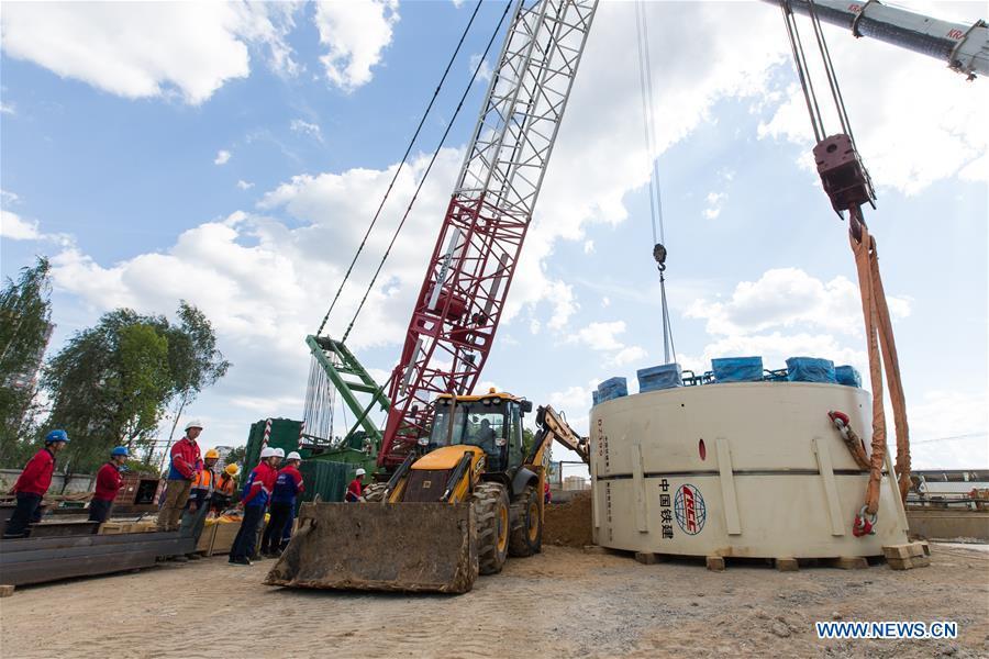 People prepare a crane at a construction site in Moscow, capital of Russia, June 3, 2018. Since August 2017, China Railway Construction Corporation Limited (CRCC) has been building a 4.6-km section and three stations on the \