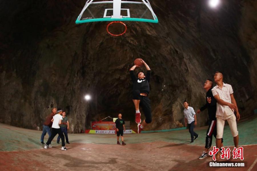 A view of a basketball court built inside a Karst cave in Xinchun Village, Nayong County, Guizhou Province. The basketball court was built with governmental subsidies as well as donations from local residents. It opened last December after it was equipped with an auditorium. (Photo: China News Service/Han Xianpu)
