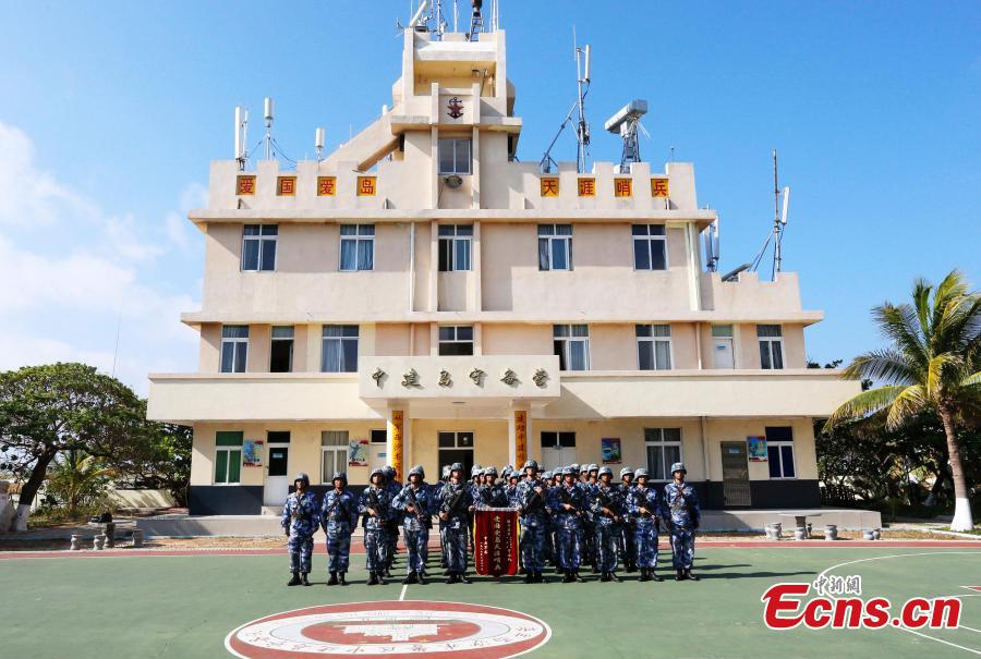 PLA Navy soldiers work on Zhongjian Island of Xisha Islands in South China Sea, Hainan Province. Over dozens of years, soldiers have transformed the barren site into a lush area despite the harsh environment of high temperatures, high humidity, high salt and lack of fresh water. (Photo: China News Service/Wang Xiaobin)