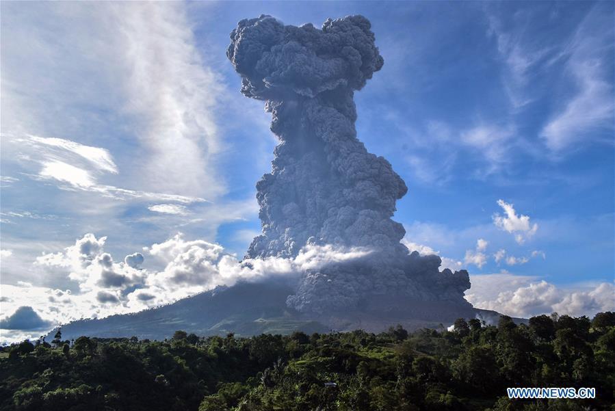The photo taken on June 9, 2019 shows Mount Sinabung spewing thick ash in Karo, North Sumatra, Indonesia. A column of thick ash was spewed seven km high to the sky from the crater of Mount Sinabung volcano in Sumatra Island of western Indonesia on Sunday, the country\'s national volcanology agency said. (Xinhua/Anto Sembiring)