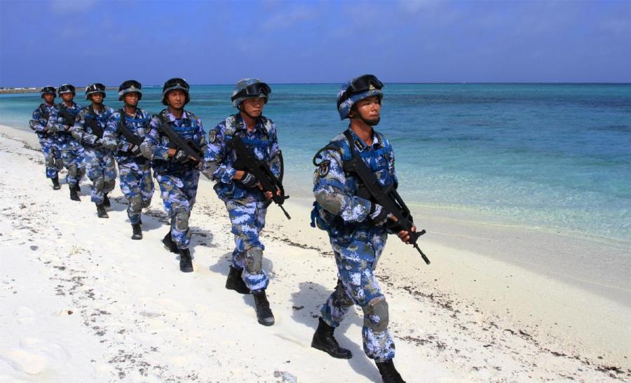 Sailors stationed on Zhongjian Island attend morning drill. (CAI SHENGQIU/FOR CHINA DAILY)

Natural dangers

He quickly understood. In September 2006, Typhoon Xangsane plowed across Southeast Asia, causing large waves that washed over the beach time and again.

\