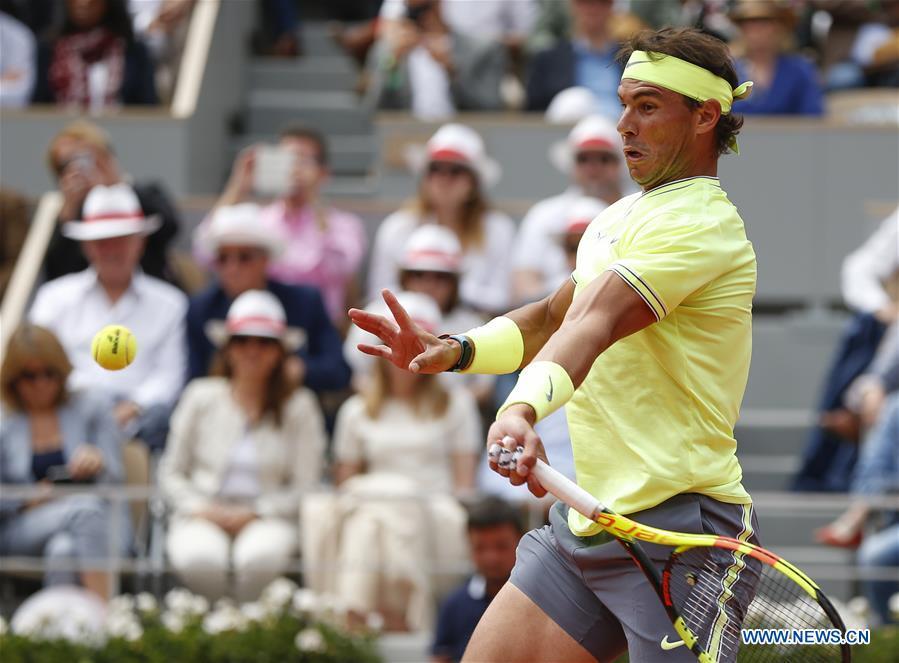 Rafael Nadal of Spain competes during the men\'s singles final with Dominic Thiem of Austria at French Open tennis tournament 2019 at Roland Garros, in Paris, France on June 9, 2019. (Xinhua/Han Yan)
