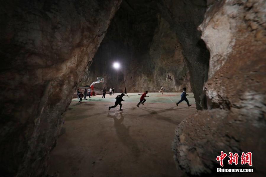 A view of a basketball court built inside a Karst cave in Xinchun Village, Nayong County, Guizhou Province. The basketball court was built with governmental subsidies as well as donations from local residents. It opened last December after it was equipped with an auditorium. (Photo: China News Service/Han Xianpu)
