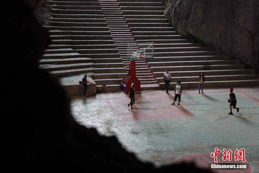 A view of a basketball court built inside a Karst cave in Xinchun Village, Nayong County, Guizhou Province. The basketball court was built with governmental subsidies as well as donations from local residents. It opened last December after it was equipped with an auditorium. (Photo: China News Service/Han Xianpu)