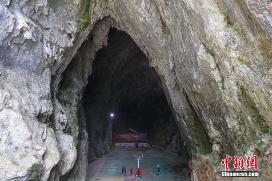 A view of a basketball court built inside a Karst cave in Xinchun Village, Nayong County, Guizhou Province. The basketball court was built with governmental subsidies as well as donations from local residents. It opened last December after it was equipped with an auditorium. (Photo: China News Service/Han Xianpu)