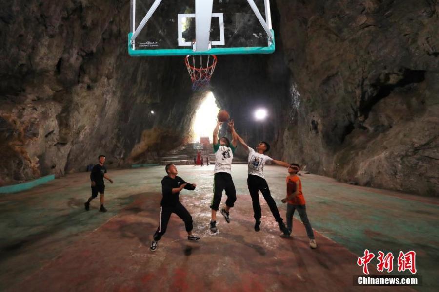 A view of a basketball court built inside a Karst cave in Xinchun Village, Nayong County, Guizhou Province. The basketball court was built with governmental subsidies as well as donations from local residents. It opened last December after it was equipped with an auditorium. (Photo: China News Service/Han Xianpu)