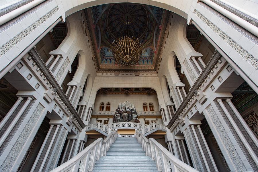 Photo taken on April 14, 2019 shows a stairway at the entrance of the Kohi Navruz (Navruz Palace) in Dushanbe, Tajikistan. The building has 12 halls, each of which is made in a unique style. (Xinhua/Bai Xueqi)