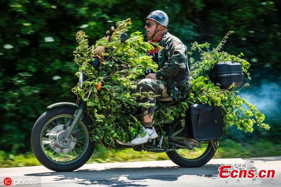 A man drives his quad bike at the International Off-road Festival in somogybabod, Hungary on June 8, 2019. The annual festival is the largest off-road event in Europe, featuring some 1,200 amateur race vehicles and more than 20 thousand participants. (Photo/IC)