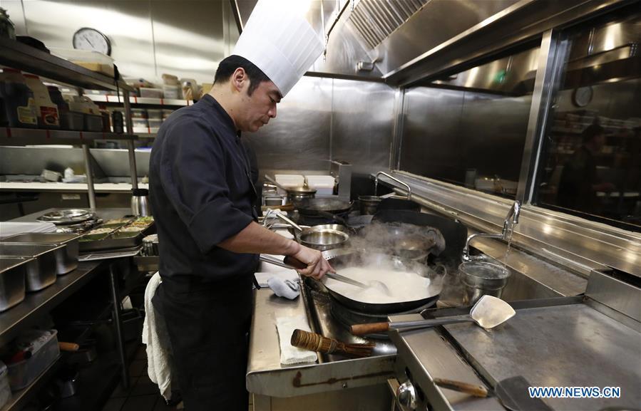 A chef works at the kitchen of Bistro Na\'s in Temple City, Los Angeles, the United States, on June 7, 2019. Bistro Na\'s in Los Angeles made headlines this week with the announcement that it had been awarded a coveted Michelin Star by the famed Michelin Restaurant Guide. This special ranking broke Michelin\'s 10-year absence from Los Angeles, and made Bistro Na\'s the only Chinese restaurant in Southern California to be so honored. (Xinhua/Li Ying)