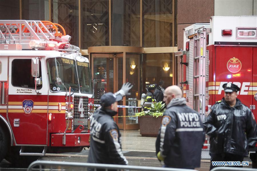 Rescuers and police officers work near the building where a helicopter crashed in Manhattan, New York, the United States, June 10, 2019. One person was killed after a helicopter crashed onto the roof of a skyscraper in Midtown Manhattan of New York City Monday afternoon, according to media reports. (Xinhua/Wang Ying)