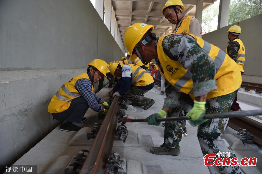 The entire track-laying construction for the Beijing-Zhangjiakou high-speed railway was completed on June 12, 2019. The railway is 174 kilometers long, which is an important traffic guarantee measure for the Beijing Winter Olympic Games in 2022. After completion, the time from Beijing to Zhangjiakou by train will be shortened from three hours to less than one hour, which is of great significance for promoting the coordinated development of Beijing, Tianjin and Hebei and also connecting the western region.(Photo/VCG)