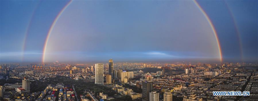 Stitched aerial photo taken on June 11, 2019 shows double rainbow arching across Changchun City, northeast China\'s Jilin Province. A double rainbow brightened the sky over Changchun City after a strong rainfall hit the city. (Xinhua/Xu Chang)