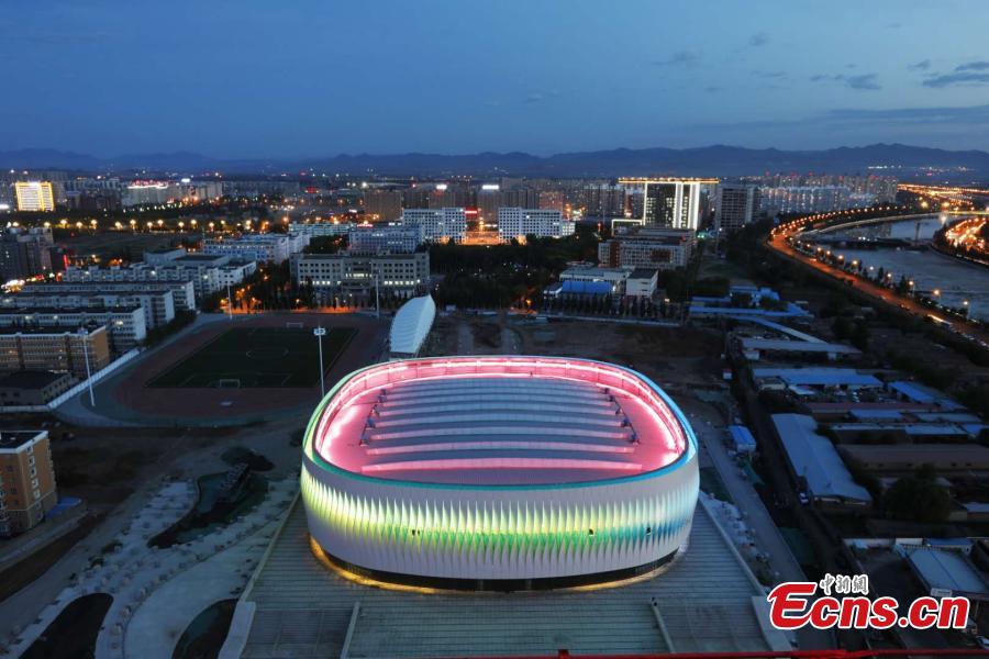 The illuminated gymnasium newly built at Hebei North University in Zhangjiakou City, North China’s Hebei Province. With a total investment of 261 million yuan ($37.8 million), the building has a floor area of 26,300 square meters and is the first dome structure gymnasium in Hebei. It can be used to host international and national competitions for many ice-based events, such as ice hockey, short-track speed skating and figure skating. (Photo: China News Service/Wu Diansen)