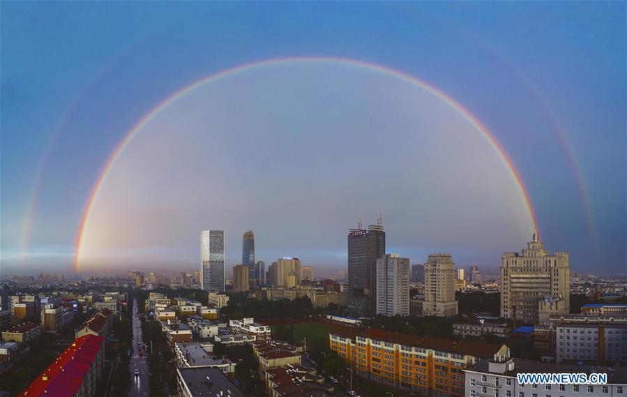 Stitched aerial photo taken on June 11, 2019 shows double rainbow arching across Changchun City, northeast China\'s Jilin Province. A double rainbow brightened the sky over Changchun City after a strong rainfall hit the city. (Xinhua/Xu Chang)