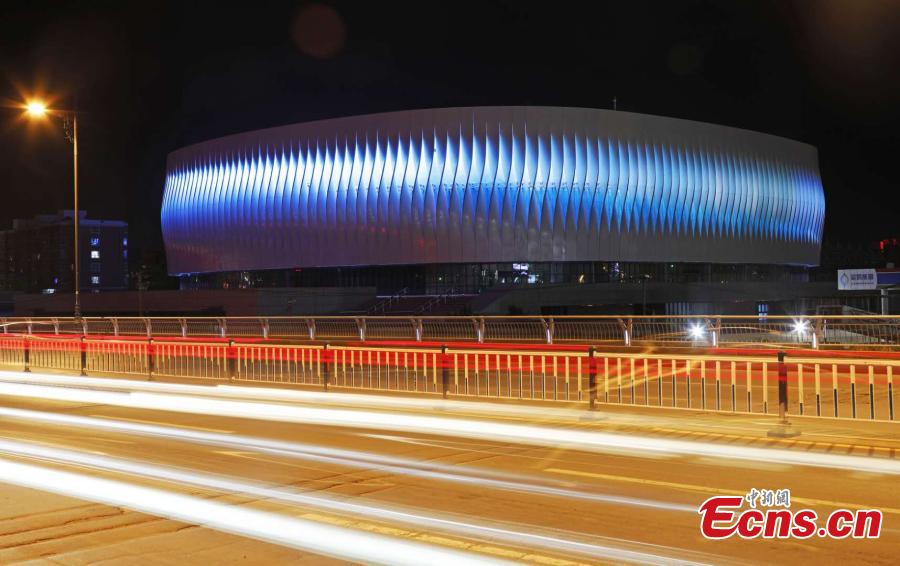 The illuminated gymnasium newly built at Hebei North University in Zhangjiakou City, North China’s Hebei Province. With a total investment of 261 million yuan ($37.8 million), the building has a floor area of 26,300 square meters and is the first dome structure gymnasium in Hebei. It can be used to host international and national competitions for many ice-based events, such as ice hockey, short-track speed skating and figure skating. (Photo: China News Service/Wu Diansen)