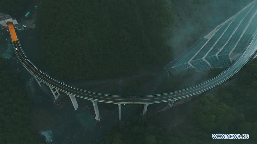 Aerial photo taken on June 11, 2019 shows a car running on the highway linking Zhalonggou with Nianbo Township in northwest China\'s Qinghai Province. A 50.79-km highway linking Zhalonggou and Nianbo Township in Qinghai Province opened to the traffic on Tuesday. (Xinhua/Zhang Hongxiang)