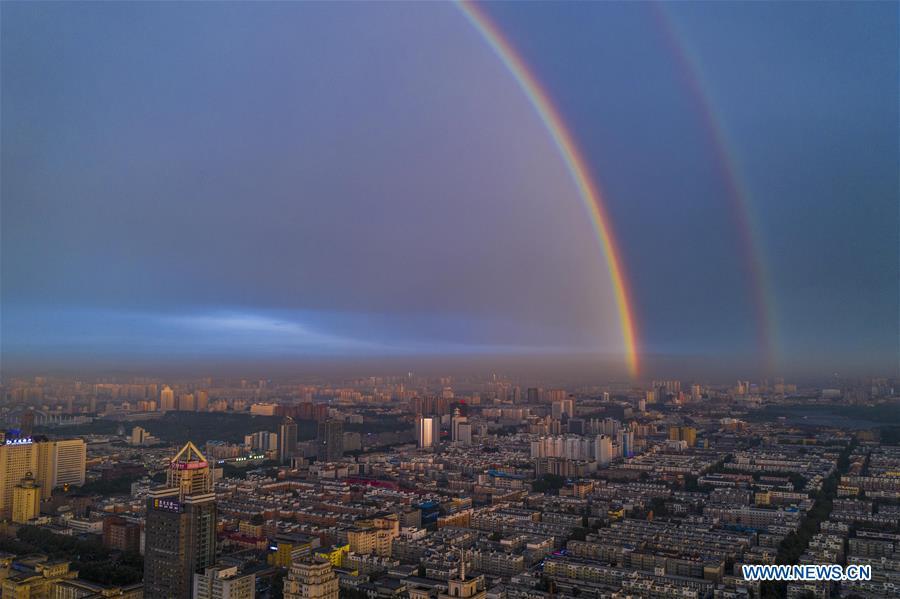 Aerial photo shows double rainbow arching across Changchun City, northeast China\'s Jilin Province, on June 11, 2019. A double rainbow brightened the sky over Changchun City after a strong rainfall hit the city. (Xinhua/Xu Chang)