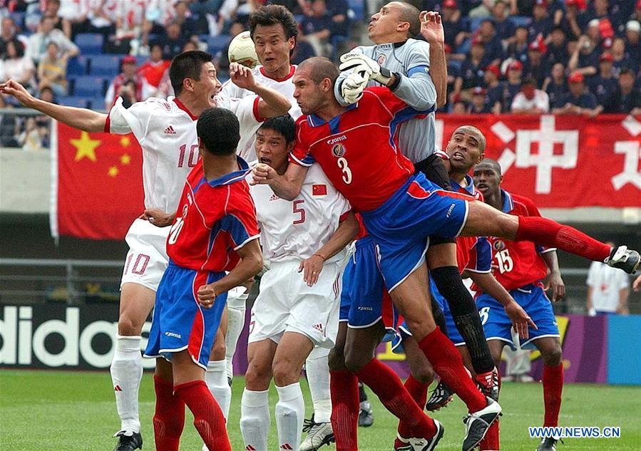 Players of China (in white) and Costa Rica compete during a Group C match at the 2002 FIFA World Cup finals in Gwangju, South Korea, June 4, 2002. This year marks the 70th anniversary of the founding of the People\'s Republic of China (PRC). On April 5, 1959, Rong Guotuan won the champion of the men\'s singles event at the 25th ITTF World Table Tennis Championships in Dortmund, Germany, becoming China\'s first ever world champion. Chinese players have made more achievements during the 60 years since then. (Xinhua/Guo Dayue)