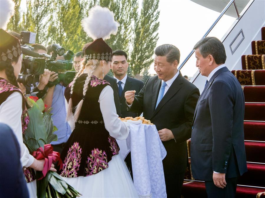 Chinese President Xi Jinping has a cordial talk with his Kyrgyz counterpart Sooronbay Jeenbekov upon his arrival in Bishkek, Kyrgyzstan, June 12, 2019. Xi arrived here Wednesday for a state visit to Kyrgyzstan and the 19th Shanghai Cooperation Organization (SCO) summit. (Xinhua/Xie Huanchi)