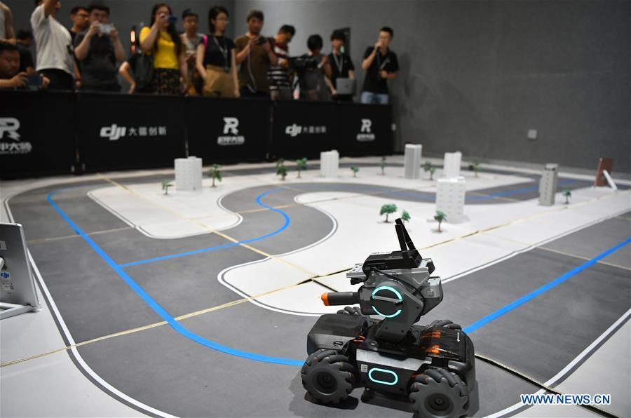 Photo taken on June 12, 2019 shows an educational robot produced by Chinese drone maker DJI at an event in Beijing, capital of China. DJI launched its first educational robot RoboMaster S1 at an event on Wednesday. The robot, supporting 2 programming languages, features a configuration of 31 sensors and 46 programmable components. (Xinhua/Wang Qingqin)