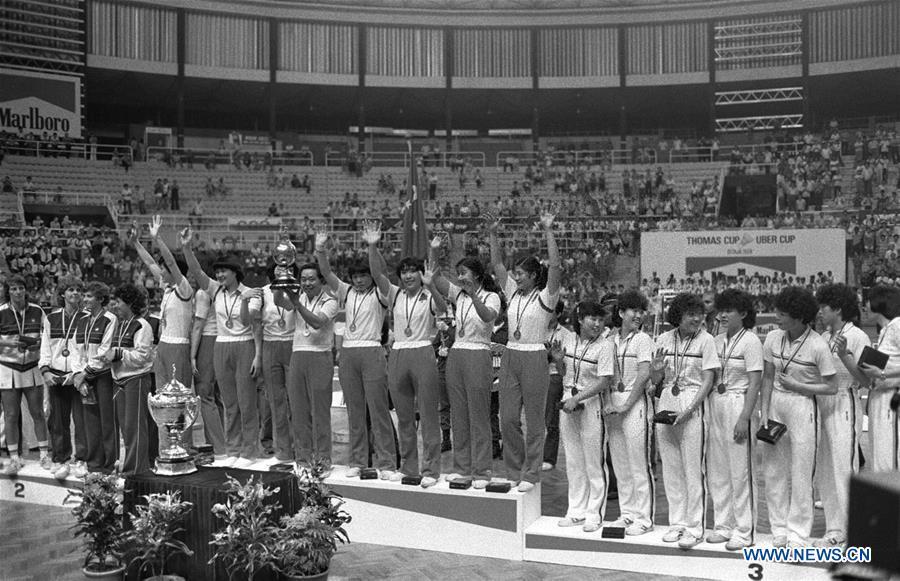 Members of the Chinese badminton team attend the awarding ceremony after winning the champion at the 10th Uber Cup badminton tournament in Kuala Lumpur, Malaysia, May 17, 1984. This year marks the 70th anniversary of the founding of the People\'s Republic of China (PRC). On April 5, 1959, Rong Guotuan won the champion of the men\'s singles event at the 25th ITTF World Table Tennis Championships in Dortmund, Germany, becoming China\'s first ever world champion. Chinese players have made more achievements during the 60 years since then. (Xinhua)
