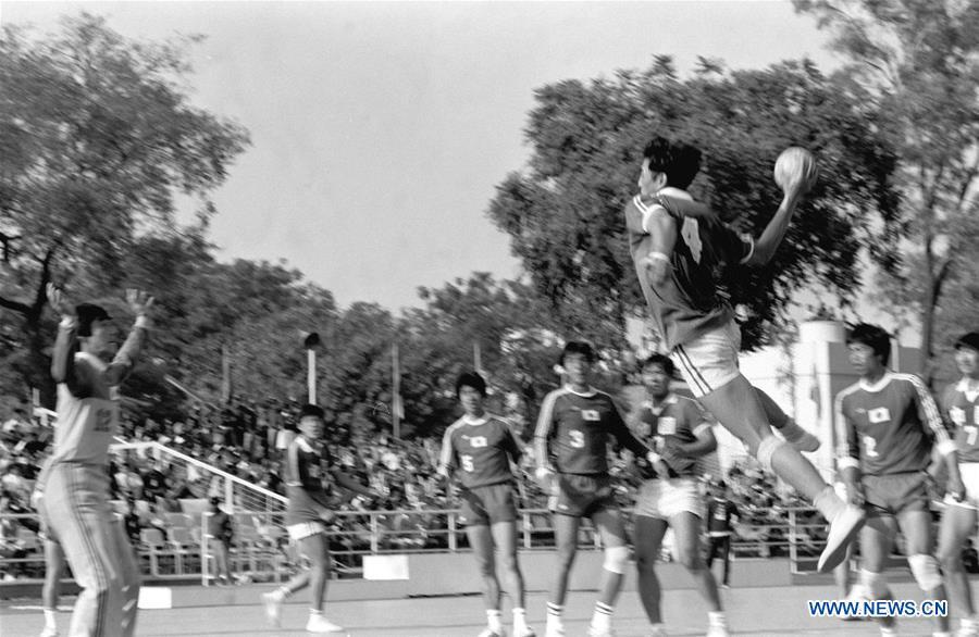 Wu Mingqun of China competes during the men\'s handball final against Japan at the Asian Games in New Delhi, India, Nov. 30, 1982. This year marks the 70th anniversary of the founding of the People\'s Republic of China (PRC). On April 5, 1959, Rong Guotuan won the champion of the men\'s singles event at the 25th ITTF World Table Tennis Championships in Dortmund, Germany, becoming China\'s first ever world champion. Chinese players have made more achievements during the 60 years since then. (Xinhua/Liu Xinning)