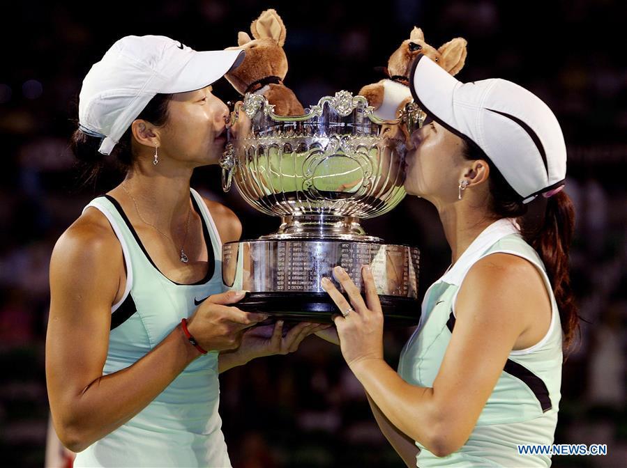 Zheng Jie (R) and Yan Zi kiss the trophy of the women\'s doubles champion at the Australian Open tennis tournament in Melbourne Jan. 27, 2006. This year marks the 70th anniversary of the founding of the People\'s Republic of China (PRC). On April 5, 1959, Rong Guotuan won the champion of the men\'s singles event at the 25th ITTF World Table Tennis Championships in Dortmund, Germany, becoming China\'s first ever world champion. Chinese players have made more achievements during the 60 years since then. (Xinhua)