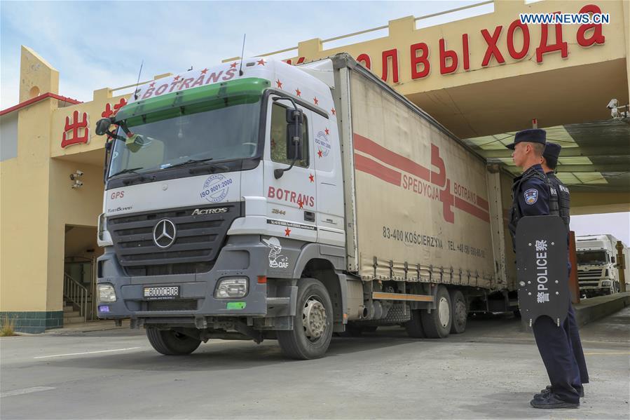 A vehicle from Tajikistan passes the Karasu port in Tajik Autonomous County of Taxkorgan, northwest China\'s Xinjiang Uygur Autonomous Region, on June 11, 2019. With the Belt and Road Initiative, trade between China and Tajikistan has continued to develop. The Karasu port between the two countries has seen large quantities of goods cleared by customs every year. (Xinhua/Huang Huan)