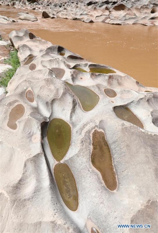 Photo taken on June 16, 2019 shows a pothole landscape along the Shenyu River valley in Huoshi Village of Tieliu Township, Huidong County, southwest China\'s Sichuan Province. (Xinhua/Jiang Hongjing)