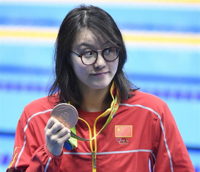 China's Fu Yuanhui attends the awarding ceremony of women's 100m backstroke swimming final at the 2016 Rio Olympic Games in Rio de Janeiro, Brazil, on Aug. 8, 2016. Fu Yuanhui won the bronze medal with 58.76 seconds. (Xinhua/Wang Peng) China's Fu Yuanhui attends the awarding ceremony of women's 100m backstroke swimming final at the 2016 Rio Olympic Games in Rio de Janeiro, Brazil, on Aug. 8, 2016. Fu Yuanhui won the bronze medal with 58.76 seconds. (Xinhua/Wang Peng)