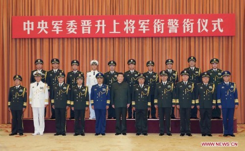 Chinese President Xi Jinping (C, front), also general secretary of the Communist Party of China (CPC) Central Committee and chairman of the Central Military Commission (CMC), poses for a group photo with millitary officers in Beijing, capital of China, July 31, 2015. Xi presented certificates of command to ten senior military and police officers who were conferred the rank of general by the CMC at a promotion ceremony here Friday. (Xinhua/Li Gang) Chinese President Xi Jinping (C, front), also general secretary of the Communist Party of China (CPC) Central Committee and chairman of the Central Military Commission (CMC), poses for a group photo with millitary officers in Beijing, capital of China, July 31, 2015. Xi presented certificates of command to ten senior military and police officers who were conferred the rank of general by the CMC at a promotion ceremony here Friday. (Xinhua/Li Gang)