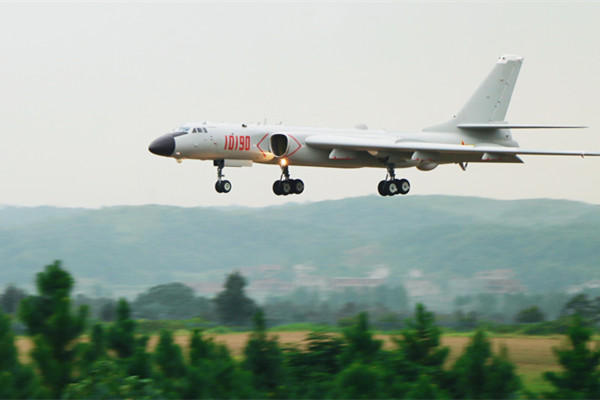 A PLA Air Force H-6K bomber conducts a training flight in Guangzhou, Guangdong province, in August. (Photo/Xinhua) A PLA Air Force H-6K bomber conducts a training flight in Guangzhou, Guangdong province, in August. (Photo/Xinhua)