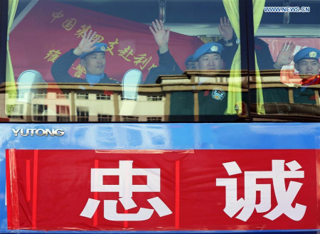 Members of a Chinese peacekeeping police squad for mission in Liberia wave to colleagues after a departure ceremony in Langfang, north China's Hebei Province, March 10, 2016. (Xinhua/Yin Gang) Members of a Chinese peacekeeping police squad for mission in Liberia wave to colleagues after a departure ceremony in Langfang, north China's Hebei Province, March 10, 2016. (Xinhua/Yin Gang)