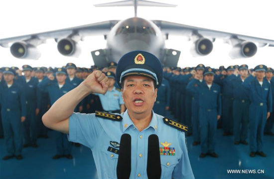 Chen Gang (front), a division commander of the People's Liberation Army (PLA) Air Force, takes the oath during the hand over ceremony of the Y-20, China's homegrown large transport aircraft, in Chengdu, capital of southwest China's Sichuan Province, July 6, 2016. (Xinhua/Liu Yinghua) Chen Gang (front), a division commander of the People's Liberation Army (PLA) Air Force, takes the oath during the hand over ceremony of the Y-20, China's homegrown large transport aircraft, in Chengdu, capital of southwest China's Sichuan Province, July 6, 2016. (Xinhua/Liu Yinghua)