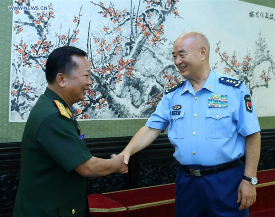 Xu Qiliang (R), vice chairman of China's Central Military Commission (CMC), meets with Lao Minister of Defense Lieutenant-General Chansamone Chanyalath in Beijing, capital of China, July 18, 2016. (Xinhua/Ding Haitao) Xu Qiliang (R), vice chairman of China's Central Military Commission (CMC), meets with Lao Minister of Defense Lieutenant-General Chansamone Chanyalath in Beijing, capital of China, July 18, 2016. (Xinhua/Ding Haitao)