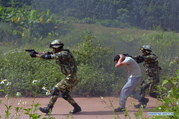 Police officers take part in a joint anti-terrorist exercise between Chinese and Laotian police in Xishuangbanna of southwest China's Yunnan Province, Sept. 13, 2016. A total of 280 police officers from Yunnan's Xishuangbanna prefecture and Luang Namtha Province of Laos participated in the 90-minute drill, which started at 10 a.m. on Tuesday. (Photo: Xinhua/Chen Haining) Police officers take part in a joint anti-terrorist exercise between Chinese and Laotian police in Xishuangbanna of southwest China's Yunnan Province, Sept. 13, 2016. A total of 280 police officers from Yunnan's Xishuangbanna prefecture and Luang Namtha Province of Laos participated in the 90-minute drill, which started at 10 a.m. on Tuesday. (Photo: Xinhua/Chen Haining)