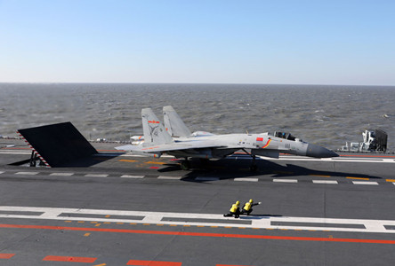 Several batches of J-15 carrier-based aircraft, carrying live ammunition, are performing strike exercises in a drill conducted by the Chinese Navy. (Photo/CRIENGLISH.com) Several batches of J-15 carrier-based aircraft, carrying live ammunition, are performing strike exercises in a drill conducted by the Chinese Navy. (Photo/CRIENGLISH.com)