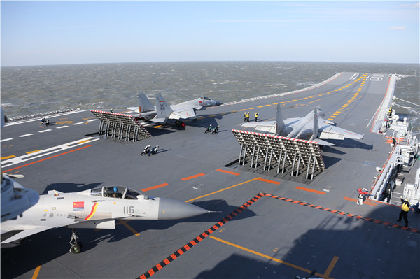Carrier-based J-15 fighters prepare to take off from aircraft carrier Liaoning in a drill in the Bohai Sea. Photos by Mo Xiaoliang / for China Daily Carrier-based J-15 fighters prepare to take off from aircraft carrier Liaoning in a drill in the Bohai Sea. Photos by Mo Xiaoliang / for China Daily